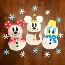 three snowmen and two bears are standing next to each other on a wooden surface