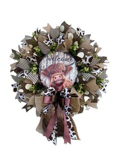 a wreath with an image of a cow on it