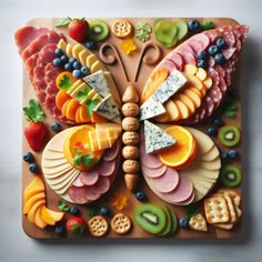 a wooden cutting board topped with lots of different types of food