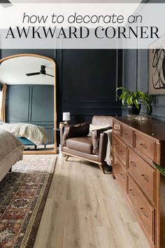 a bedroom with dark blue walls and wood floors is featured in the article how to decorate an awkward corner