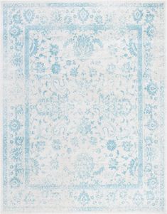 a blue and white rug with an ornate design on the bottom, in front of a white background