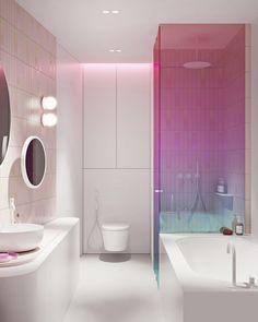 a white bathroom with pink and purple tiles on the walls, along with a bathtub