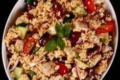 a white bowl filled with rice and veggies