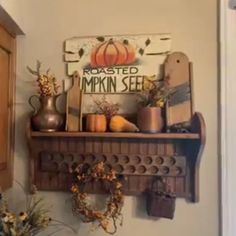 a shelf filled with pumpkins and other fall decorations