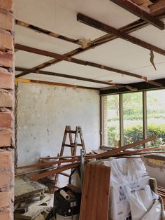 a room that is being remodeled and filled with wood