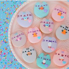 a plate filled with lots of decorated cookies