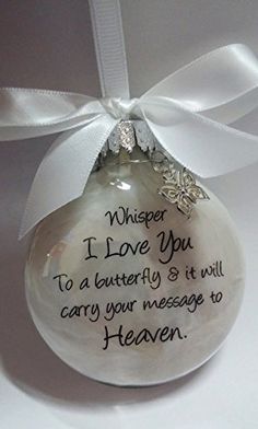 a glass ornament with a message written on it