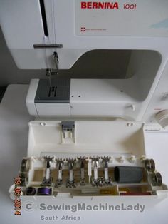 sewing machine sitting on top of a white table