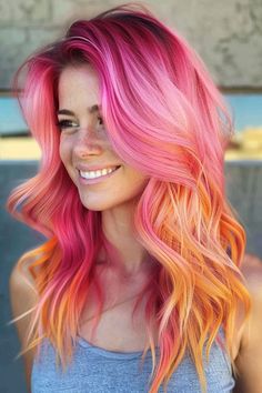 Click for More ➡️ | Save for Later ❤️  Create a fiery and fun look with a pink and orange ombre. This vibrant color combination is perfect for long hair and adds a unique touch to your style. (Pink and Orange Ombre for Long Hair) Pink Orange And Blonde Hair, Pink And Coral Hair, Orange To Pink Hair, Pop Of Color Hair Ideas, Pink To Orange Hair, Fire Color Hair, Hot Pink And Blonde Hair, Fun Colors For Hair, Sunset Hair Color Ombre