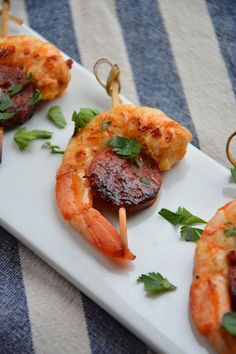 small appetizers are arranged on a white plate