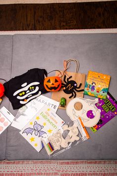 an assortment of halloween related items are laid out on the floor