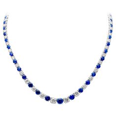 A wonderful riviera necklace, showcasing round brilliant cut blue sapphires and diamonds that alternate elegantly with each other, set on a classic four prong setting. Blue sapphires weigh 17.66 carats total and white diamonds weigh 13.15 carats total with G-H color and SI1-SI2 clarity. Finely made with 18K white gold, 36 cm in length.  Roman Malakov is a custom house, specializing in creating anything you can imagine. If you would like to receive a special quote on a custom piece, please messag Round Lab-created Sapphire Necklace Fine Jewelry, Anniversary Round Gemstone Tennis Necklace, Anniversary Gemstone Tennis Necklace, Classic Sapphire Necklace With Prong Setting, Classic Sapphire Necklaces With Prong Setting, Elegant Round Gemstone Tennis Necklace, Round Diamond Cut Necklace With Lab-created Sapphire, Round Diamond Cut Lab-created Sapphire Necklace, Elegant Gemstone Tennis Necklace