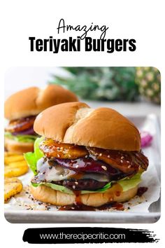 three burgers with pickles and pineapple on the side sitting on a white plate