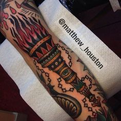 a man's arm with tattoos on it and the name nathan written in black ink