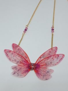 a necklace with pink and purple flowers on it