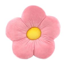 a pink flower shaped pillow with yellow center