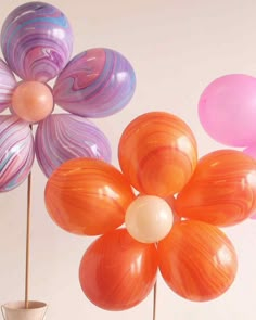 three vases with flowers in them are shown on the website page for martha stewart, diy floral balloon bouquet