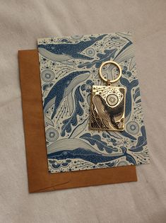 a card with a keychain on top of it