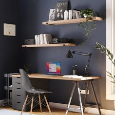 a desk with two shelves and a chair in front of it, next to a window