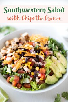 southwest salad with chipotle crema in a white bowl on top of a table