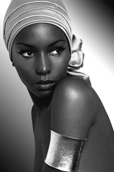 a woman with a head scarf on her head and the words beauty beyond this world