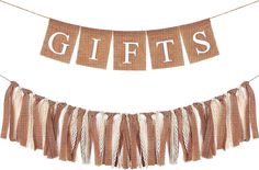 a banner with the words gifts hanging from it's sides and tassels