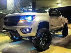 a white truck parked in a parking garage