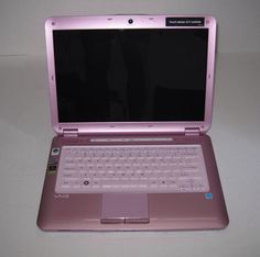 an open laptop computer sitting on top of a table