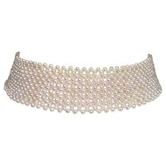 This woven white pearl choker with 14 k white gold sliding clasp is handwoven by Marina J. Each glowing white pearl (2.5-3mm) was handpicked to create an elegant and sophisticated lace-like design. This pearl choker is 1 inch wide and 13 inches long to fit the neck perfectly. A slight curve is added to the necklace to fit the curve of the natural neckline, adding a sense of grace to this already beautiful choker. The sliding clasp easy to use and secure once in place. This timeless classic piece is perfect for almost any formal outfit, a centerpiece to any look. This piece is perfect for brides as well. The brooches sold separately. **All jewelry is handmade by the designer for any custom sizing, color, material, or any other requests, please contact Marina J. Price may vary accordingly.** White Pearl Choker, Diamond Choker Necklace, Abstract Jewelry, Beautiful Chokers, Handmade Jewelry Ring, Beaded Necklace Diy, Handmade Earrings Beaded, Modern Necklaces, Beaded Choker Necklace