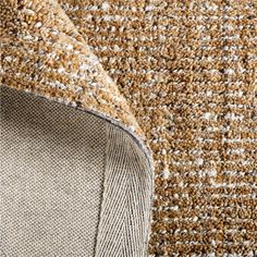 close up view of the texture of an area rug