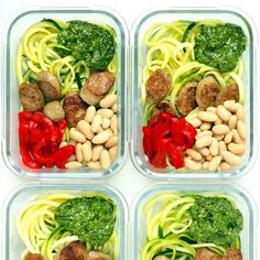 four plastic containers filled with pasta, meatballs and veggies in sauces