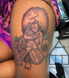 a woman with a tattoo on her thigh