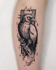 a bird with a crown on it's head is shown in this black and white tattoo