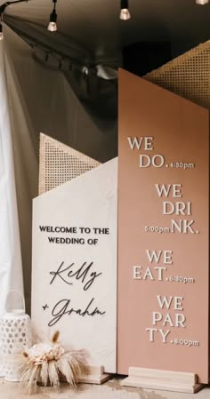 the wedding signs are on display at the reception