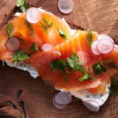 a piece of bread topped with salmon and radishes