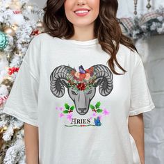 Womens Zodiac loose fit tee shirt Aries design astrology cottage core t shirt Graphic creation birth year Ram tshirt energy sign motiff crew neck top motivational mystic shirt. Womens Aires Christmas  logo Comfort Colors® 1717  streetwear boho white tee shirt.  Check out my shop at https://www.etsy.com/nz/shop/AARHOO  Comfort Colors introduces its garment-dyed t-shirt; a fully customizable tee made 100% with ring-spun cotton. The soft-washed, garment-dyed fabric brings extra coziness to your wardrobe while the relaxed fit makes it an excellent daily choice. The double-needle stitching throughout the tee makes it highly durable while the lack of side-seams helps the shirt retain its tubular shape. Medium weight fabric,  Relaxed fit, Sewn-in twill label, 100% ring-spun cotton. Size:   Do you Aries Design, Christmas Logo, White Tee Shirts, Birth Year, Crew Neck Top, Dyed Fabric, White Tee, Mens Graphic Tee, Cottage Core