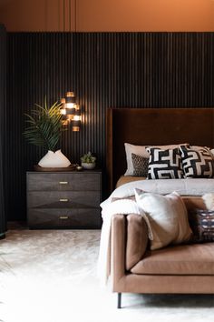 moody primary bedroom designed by violet marsh interiors Moody Primary Bedroom, Wood Headboard Bedroom, Brown Accent Wall, Walnut Bedroom Furniture, Walnut Bedroom, Feature Wall Bedroom, Earthy Bedroom, Cozy Texture, Wood Slat Wall