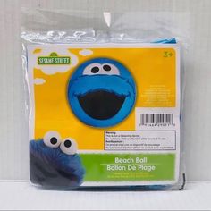 a package of sesame street beach ball balloon de plage with the face of cookie monster