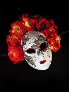 Make a bold statement with this Red Floral Mask from the Embroidered Venetian Passion Bloom collection. Adorned with fiery red and yellow flowers, this mask features intricate embroidery and elegant detailing, perfect for masquerade balls, special events, or themed parties. Its stunning floral design and traditional Venetian craftsmanship make this mask a show-stopping accessory for any occasion.

Age Group/Gender - Adult/Women

Size/Type - One size fits all adults

Mask Color -  Red/Green/Yello Kids Party Packs, Floral Mask, Red And Yellow Flowers, Red Mask, Female Mask, White Mask, Masquerade Mask, Masquerade Ball, Intricate Embroidery