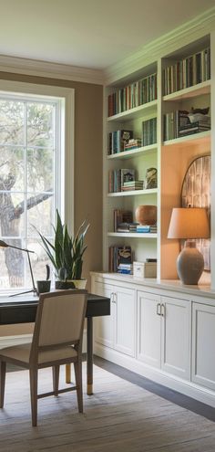 a living room filled with lots of furniture and bookshelves next to a window