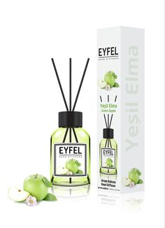 an open bottle of eyel green apple perfume next to the box