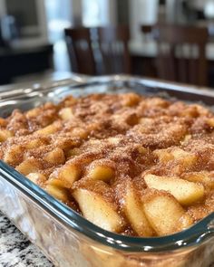 a casserole dish with apples in it on a table