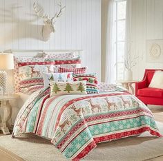 a bed room with a neatly made bed and christmas decorations on the wall behind it