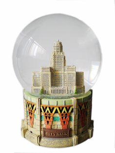 a snow globe with buildings in the background