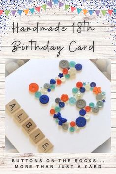 a birthday card with buttons on the rocks