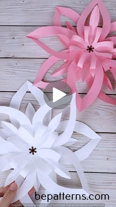 paper flowers being made with scissors and glue