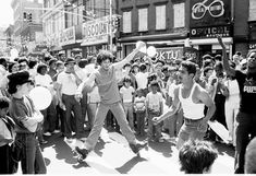 a man on a skateboard in the middle of a crowd