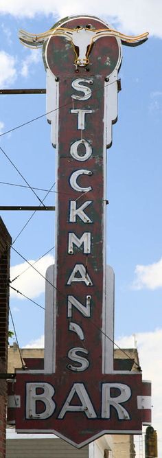 an old neon sign for a stockman's bar