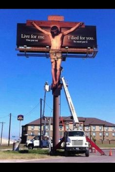 a billboard with a man on the cross