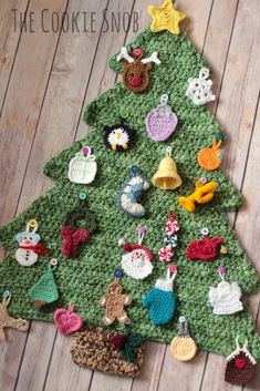 a crocheted christmas tree with lots of ornaments on it's top and bottom